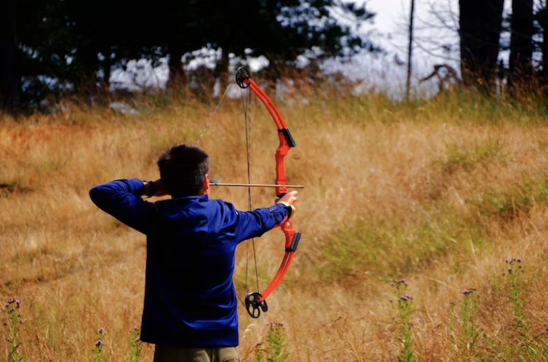 Kid shooting compound bow
